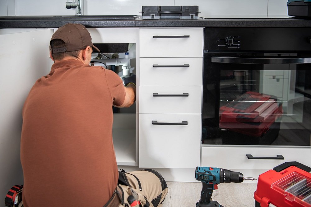 kitchen-renovation-with-technician-working-under-s-2025-10-08-08-39-19-utc